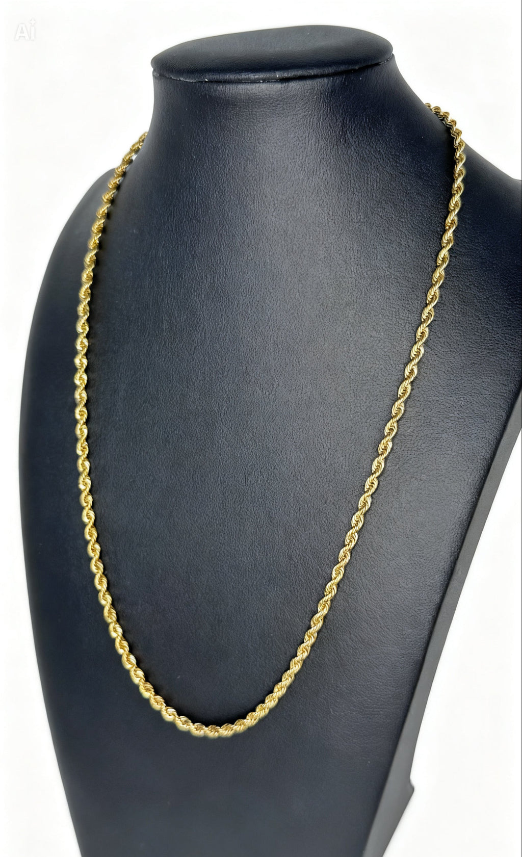 Gold chain necklace on a black mannequin bust