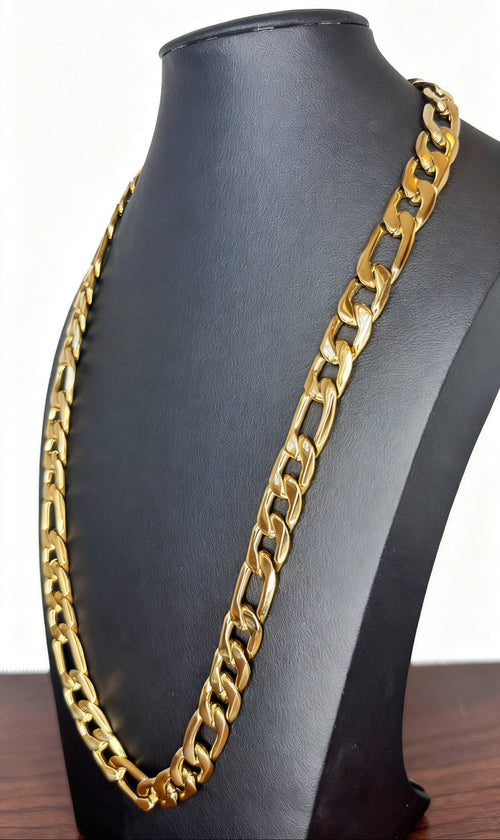 A chunky gold Figaro link chain necklace displayed on a black jewelry bust against a white background.