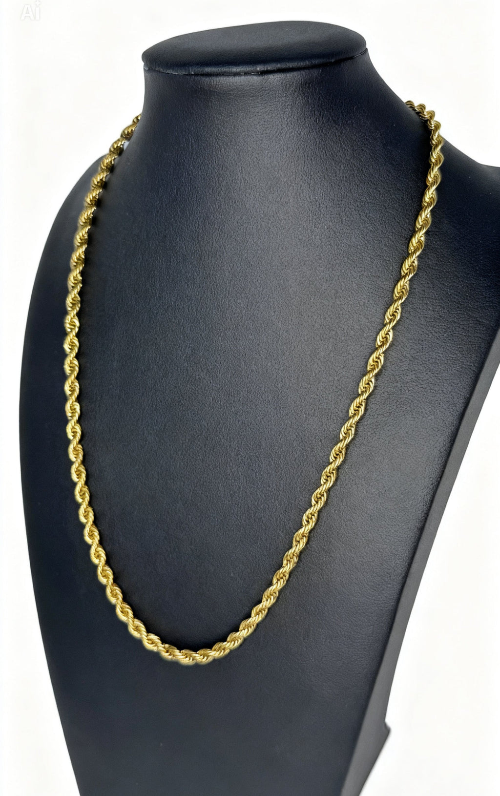 Gold chain necklace on a black mannequin