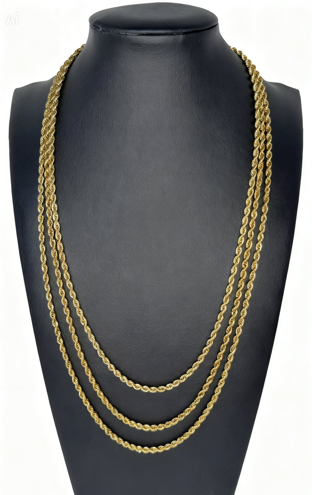Gold chain necklace stack on a black mannequin bust