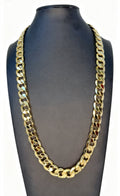 Gold chain necklace on a black mannequin bust