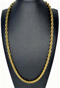 Gold rope chain necklace on a black mannequin