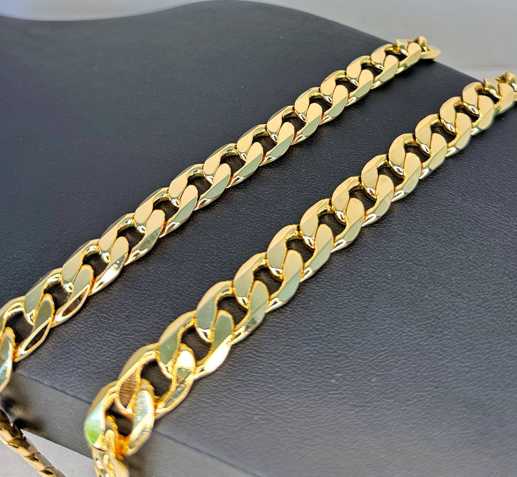 Gold chain on a dark textured surface