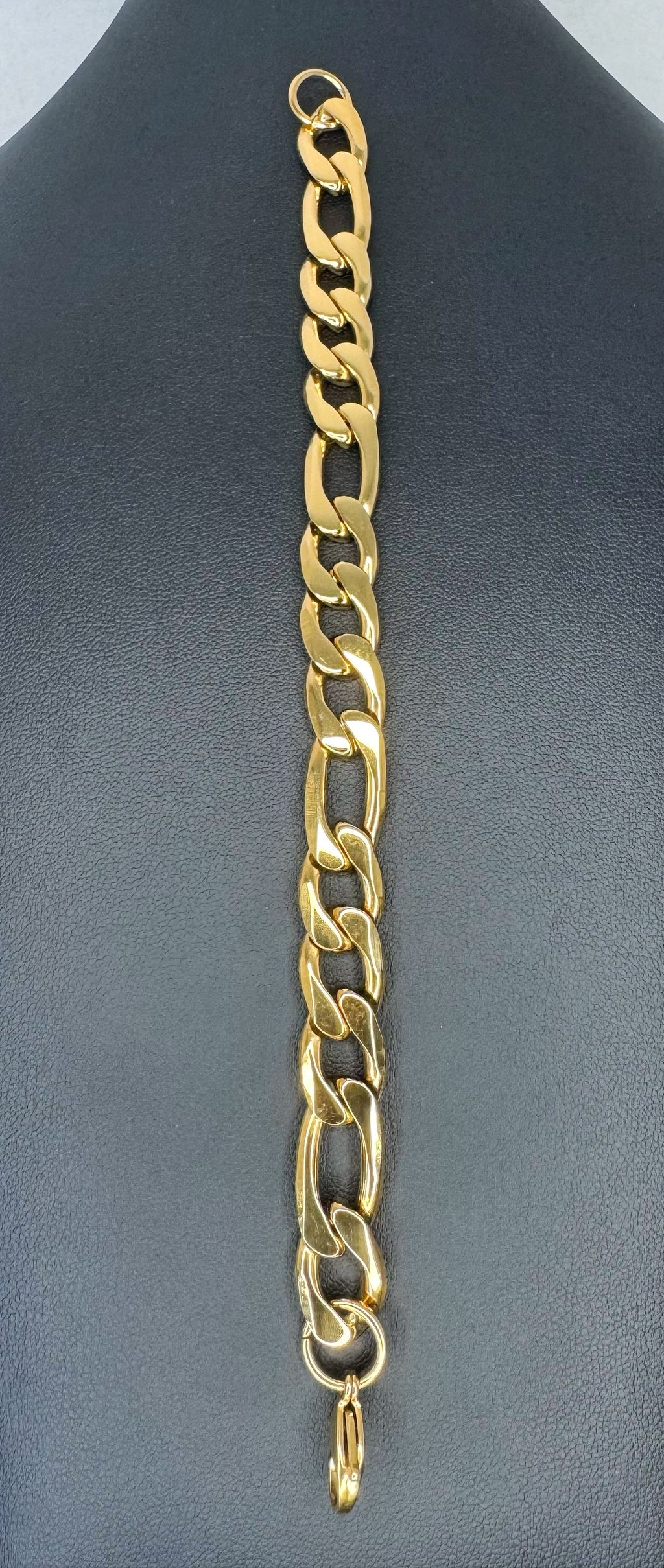 gold bracelet on black background